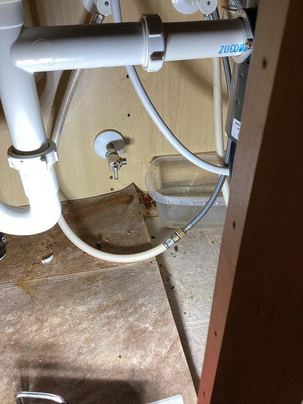 Replaced copper water supply valve with new plastic push-fit shut-off valve for dishwasher installation. Cut existing copper line and installed new stop valve to accommodate appliance connection. Verified proper shut-off operation and checked for leaks upon completion.