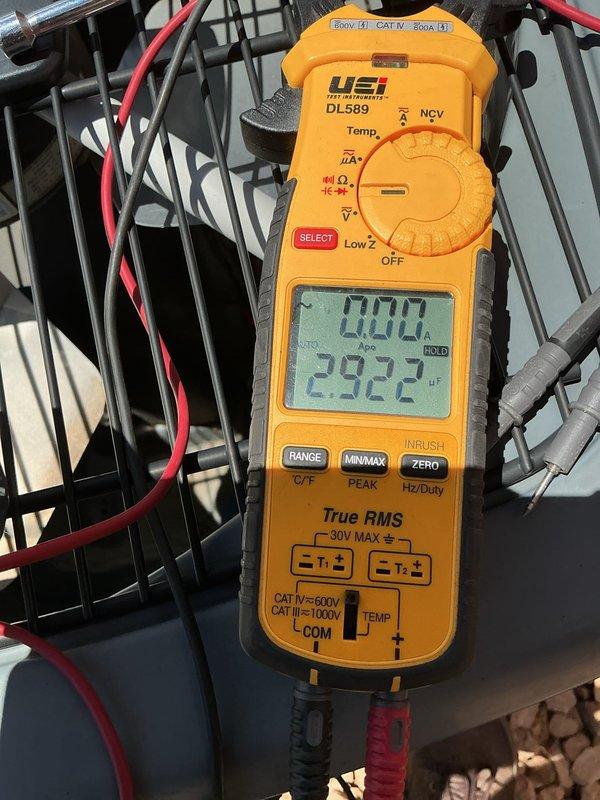 Responded to no cooling complaint on air conditioning system over 10 years old. Diagnosed failed dual capacitor preventing compressor from operating properly. Replaced defective dual capacitor with new unit, tested system operation with multimeter to verify proper capacitance readings, and confirmed system cooling normally upon departure.