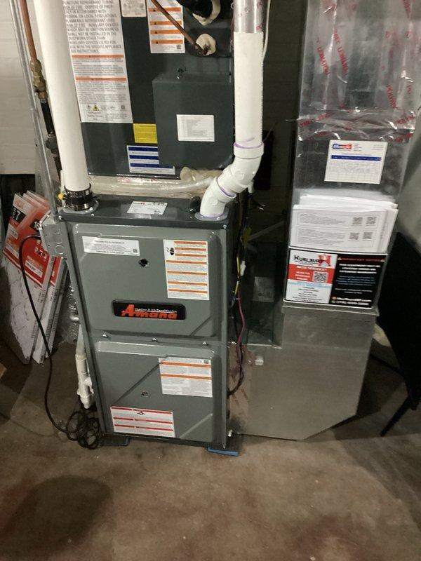 Responded to no cooling complaint on commercial RTU with weak airflow. Upon inspection, found condenser coil heavily clogged with cottonwood debris and completely restricted air filters. Cleaned condenser coil using buckets of water and power sprayer to remove debris buildup. Removed clogged filters and discovered evaporator coil completely frozen. Set system to fan-only mode to thaw evaporator coil. Advised customer that follow-up visit required to verify refrigerant charge once coil is fully thawed and to install two 18x20x2 replacement filters and perform evaporator coil cleaning with no-rinse cleaner.