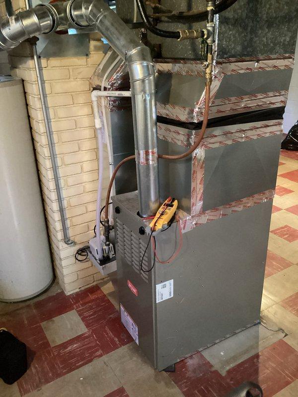 Responded to no cooling complaint on 20-year-old residential HVAC system where outdoor condenser fan was operating but inadequate cooling was present. Upon inspection and diagnostic testing, found system critically low on refrigerant charge. Due to age of equipment and extent of refrigerant loss indicating likely leak, recommended full system replacement rather than repair given that unit has exceeded typical service life expectancy and would require significant investment in obsolete components.