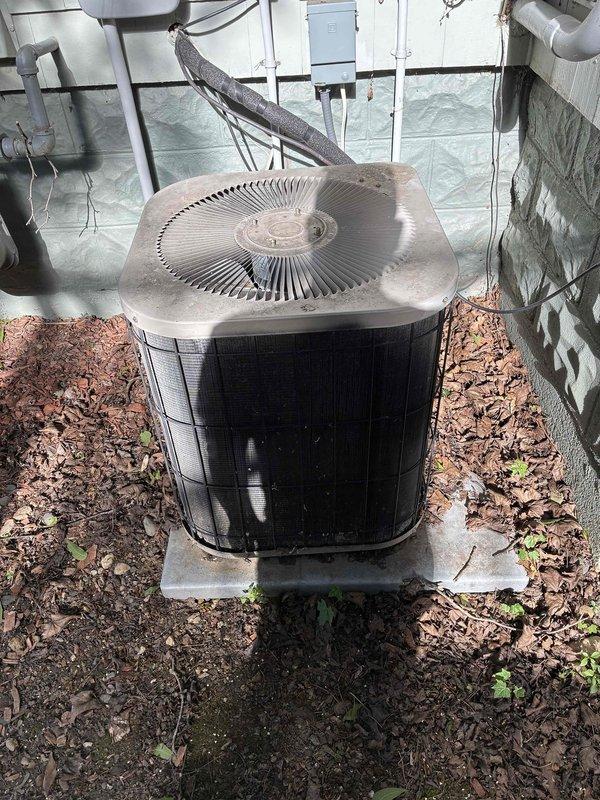 Responded to no cooling call at townhome where air conditioning system failed to communicate with furnace. Diagnosed failed thermostat by bypassing unit and confirming all components fired up properly. Replaced defective thermostat, provided operational instructions, and verified system performance with 21-degree temperature differential across coil. Advised homeowner that 26-year-old system should not receive significant future investment due to age.