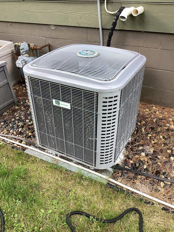 Completed preventive maintenance on a 7-10 year old residential air conditioning system. System was operating and cooling properly at time of service. Outdoor condenser coil had significant cottonwood accumulation which was thoroughly cleaned to restore proper airflow and heat transfer efficiency. Inspected and verified air filter was clean with adequate airflow. Checked all electrical connections and confirmed secure terminations throughout the system. All components tested within normal operating parameters with no deficiencies noted.