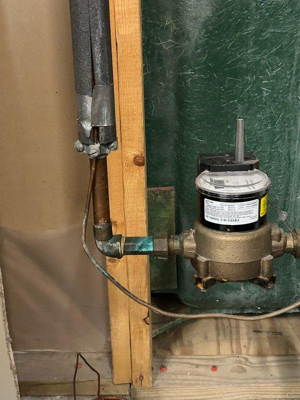 Responded to water leak at main water supply line on customer side of meter. Upon inspection, identified slow drip originating from packing nut on spigot shut-off valve. Tightened packing nut to stop active leak and provided estimates for complete valve replacement to prevent future issues.