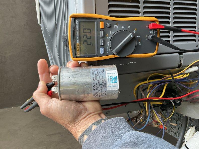 Completed annual cooling maintenance visit on 2-3 year old AC system. Performed comprehensive system inspection, cleaned outdoor condenser coils, and checked all components. Identified failed capacitor reading 22 microfarads out of rated 45 microfarads, replaced capacitor with proper specifications, and verified system operation. Changed air filter and confirmed unit operating within normal parameters.