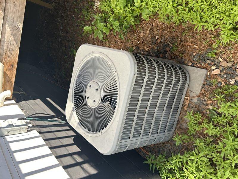 Completed comprehensive air conditioning tune-up on single-system residential unit. Tested system operation and confirmed proper temperature drop in basement zone. Inspected and verified air filter condition, blower motor, and blower capacitor all operating within normal parameters. Performed condenser coil cleaning to remove debris accumulation and verified all outdoor unit components functioning correctly. Electrical measurements confirmed appropriate amperage draw. Recommended replacement of deteriorated suction line insulation on refrigerant piping leading to outdoor unit, as existing insulation has completely degraded. System operating efficiently with no immediate service concerns identified.