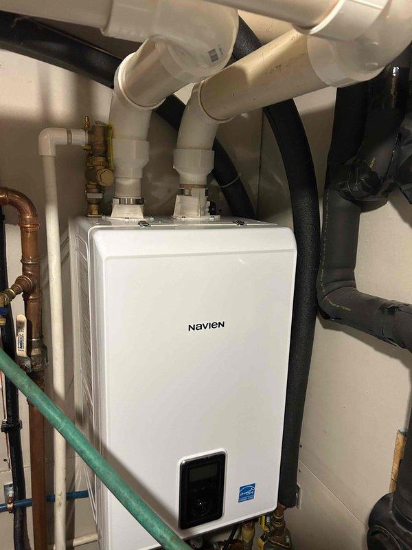 Responded to service call for geothermal system with domestic hot water issue. Coordinated with plumbing contractor who had restored cold water supply but was unable to complete hot water repairs. Performed repairs on geothermal loop system by replacing flanged plate, tension ring, and mounting bolts. Bled air from domestic hot water lines and geothermal loop lines to ensure proper system operation. Conducted system tests to verify equipment functionality. System restored to proper operation with both heating loop and hot water supply functioning correctly.