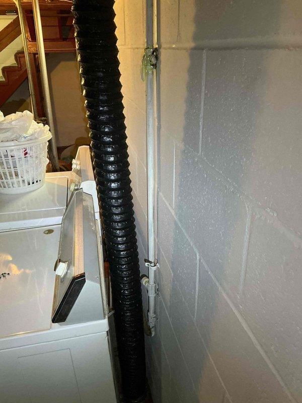 Responded to gas leak service call in basement utility area. Performed diagnostic leak check and identified active gas leak at existing 8-12 gas valve supplying clothes dryer. Valve showed signs of age-related deterioration and compromised seal integrity. Documented leak location with photographic evidence showing basement mechanical room layout including electrical panels, utility equipment, and dryer gas supply line routing. Customer informed of findings and elected to defer valve replacement to coincide with upcoming air conditioning system and water heater replacement project. Estimate prepared and accepted for future valve replacement work to be completed as part of scheduled equipment upgrades.
