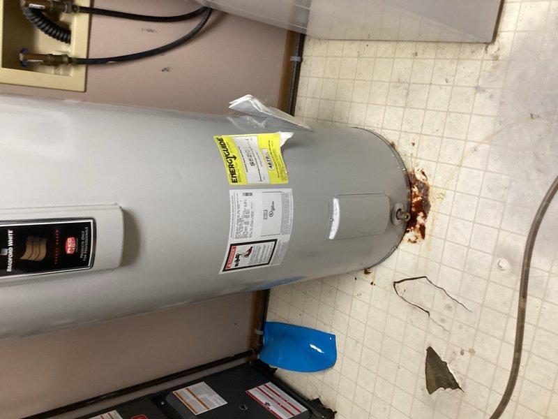 Responded to service call for 50-gallon electric water heater leaking from the bottom with visible water on floor. Upon inspection, determined unit had failed and required full replacement due to tank breach. Removed and properly disposed of old 50-gallon electric water heater. Installed new 50-gallon electric water heater unit with appropriate copper piping connections, shut-off valves, and electrical connections. Tested unit for proper operation, verified all connections for leaks, and confirmed thermostat functionality. Left installation manuals and documentation with property.