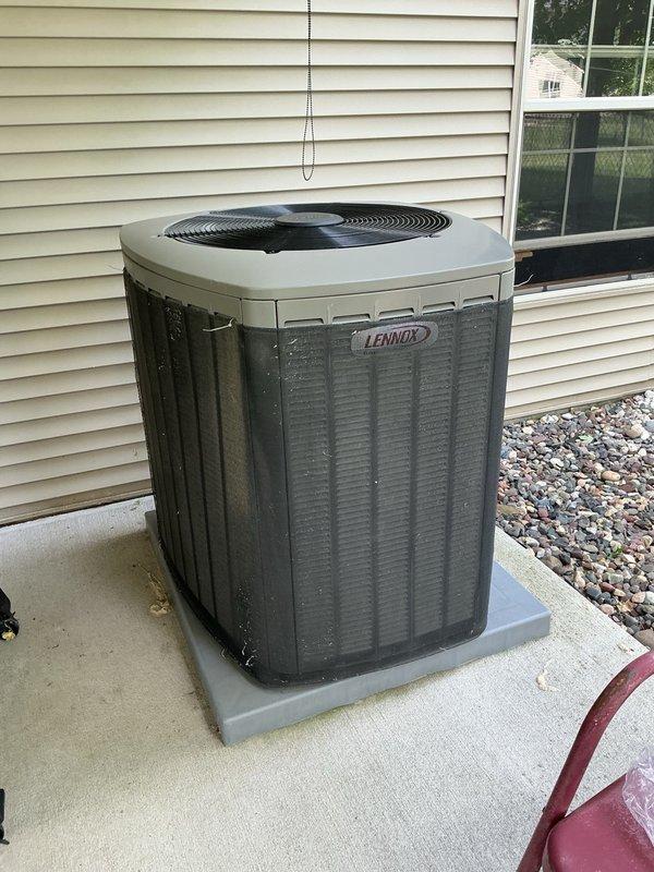 Completed comprehensive AC tune-up and maintenance service on Lennox system. Replaced dirty air filter, flushed evaporator drain line, and verified proper blower settings at indoor unit. Removed condenser panels and thoroughly cleaned heavily plugged condenser coils. Performed complete electrical inspection with no issues found and verified no pest intrusion. System startup confirmed proper operation with 19° temperature split across evaporator coil. Addressed homeowner questions regarding system operation and maintenance.