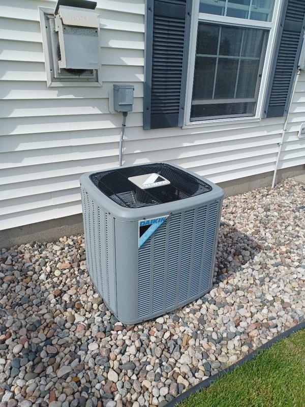 Performed comprehensive AC tune-up on Daikin condensing unit. Inspected indoor air handler, confirmed filter in good condition, and verified drain line clear and draining properly. Measured temperature split at 15.4°F across the system. Cleaned condenser coils on outdoor unit and inspected all major electrical components, with capacitor and contactor testing within normal operating range. During refrigerant circuit evaluation under 76°F ambient conditions with direct sunlight on condenser, system appears to be undercharged. Customer will contact utility provider regarding potential electrical concerns before proceeding with refrigerant service.