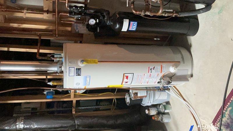 Completed cooling tune-up maintenance on one AC system and one air exchanger unit. AC system tested and operating within normal parameters with proper refrigerant pressures and temperatures verified using diagnostic equipment. Clarified air exchanger operation with customer, explaining that the unit brings fresh air into the home rather than exhausting air out, and confirmed it is functioning correctly separate from the bathroom fan system.