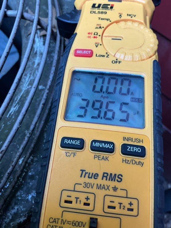 Performed comprehensive AC maintenance tune-up on 25-year-old system as part of monthly maintenance agreement. System found to be low on refrigerant and compressor drawing high amperage, indicating potential compressor failure. Measured capacitance readings at 39.65 μF and inspected evaporator coil condition, documenting moisture accumulation and component wear. Coordinated with comfort advisor for system replacement estimate and heat exchanger evaluation due to age and performance concerns.