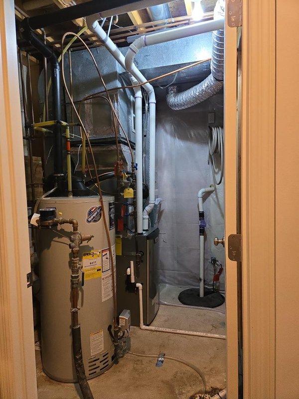 Completed furnace replacement with installation of EL297V 97% AFUE, 2-stage, variable speed upflow furnace rated at 70K BTU and Honeywell T6 digital programmable thermostat. Performed electrical upgrades including proper grounding means to furnace switch box, added strap to EMT conduit, and verified all wire connections were torqued to manufacturer specifications. Successfully completed VuSpex inspection ELE2605-02577 and documented installation with photographs of mechanical space and electrical panel.