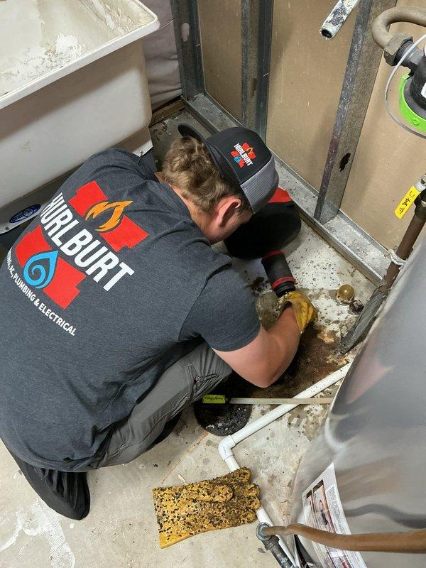 Responded to floor drain backup issue on lower level. Performed diagnostic testing by running water at laundry tub, which caused immediate backup at floor drain. Flushed toilet on same floor with no backup observed, confirming main sewer line was open and blockage was isolated to branch line serving floor drain, laundry, and kitchen.

Cabled both floor drain and laundry drain multiple times using full cable length to clear obstruction. Removed accumulated debris from floor drain using vacuum. Conducted flow test by filling and dumping laundry tub; drainage functioned properly with no backup observed.

Performed camera inspection of floor drain line, identifying minor belly in pipe with standing water that did not impact drainage performance. Scoped main sewer line approximately 30 feet until encountering obstruction at pipe joint. Main line appeared to be plastic pipe in good overall condition. Branch line blockage successfully cleared and normal drainage restored.