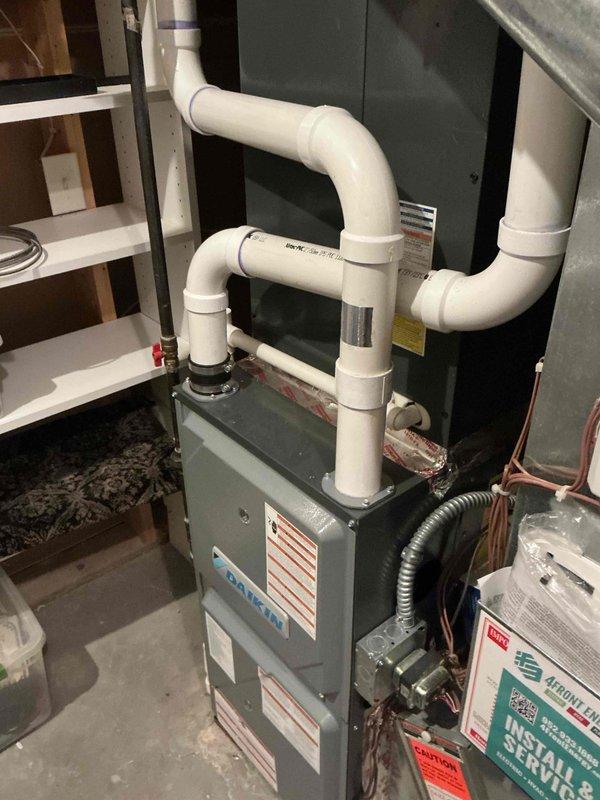 Completed spring preventive maintenance inspection on 4-year-old Daikin air conditioning system and wall furnace per maintenance agreement. Performed comprehensive AC tune-up including operational testing of outdoor condenser unit and indoor air handler, verified refrigerant levels and electrical connections, inspected condensate drainage system and PVC venting configuration on furnace unit. All equipment found operational with no deficiencies noted; system performing within manufacturer specifications.