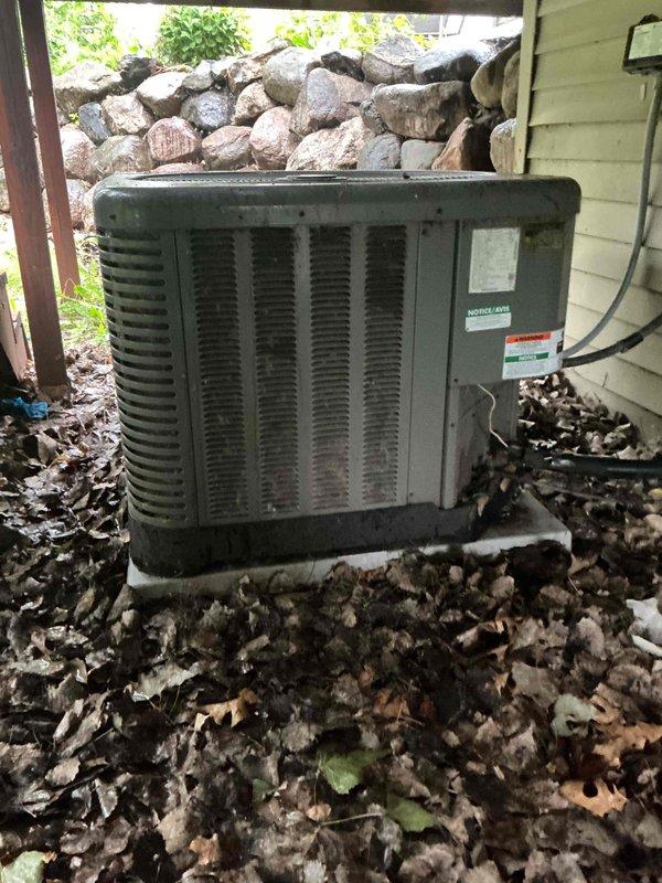 Performed comprehensive AC tune-up on 11-year-old Ruud air conditioning system. Inspection revealed rodent intrusion in condenser unit with mice chewing low voltage wiring. Verified contactor, capacitor, and control board functioning properly with amp draws within specification. Measured temperature drop at 18 degrees, confirming proper system performance. Found evaporator coil and filter clean, refrigerant charge at correct levels. Identified condenser coil requiring disassembly cleaning due to dirt accumulation. Documented findings with photographs and provided customer with repair options and recommendations via email.