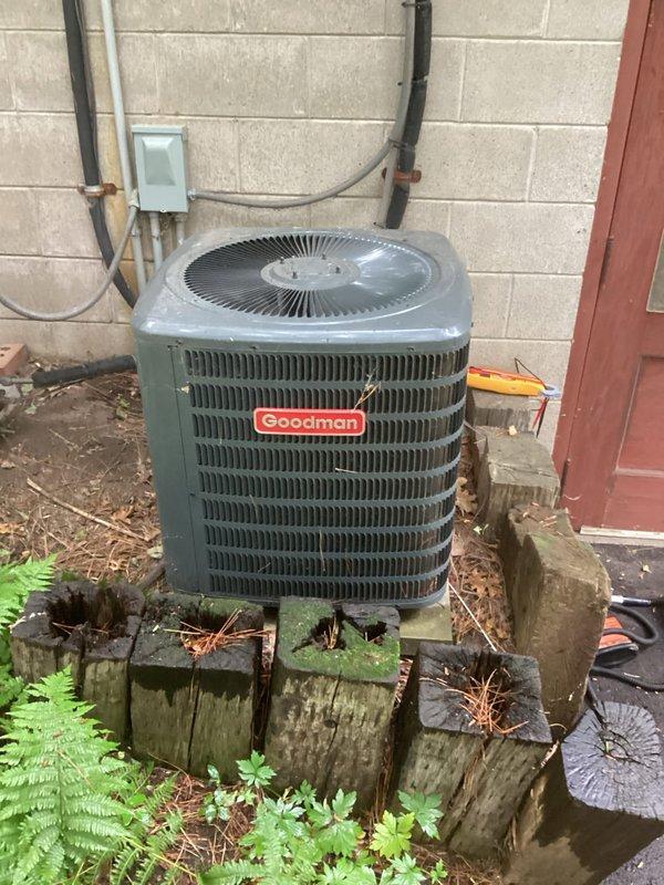 Completed annual AC tune-up and maintenance visit on a Goodman outdoor condensing unit. Performed comprehensive system inspection, verified all components operating within normal parameters, and confirmed unit is clean and in good working condition. Customer reported system has been performing well with no current issues; noted previous condensate drain issue had been previously resolved.
