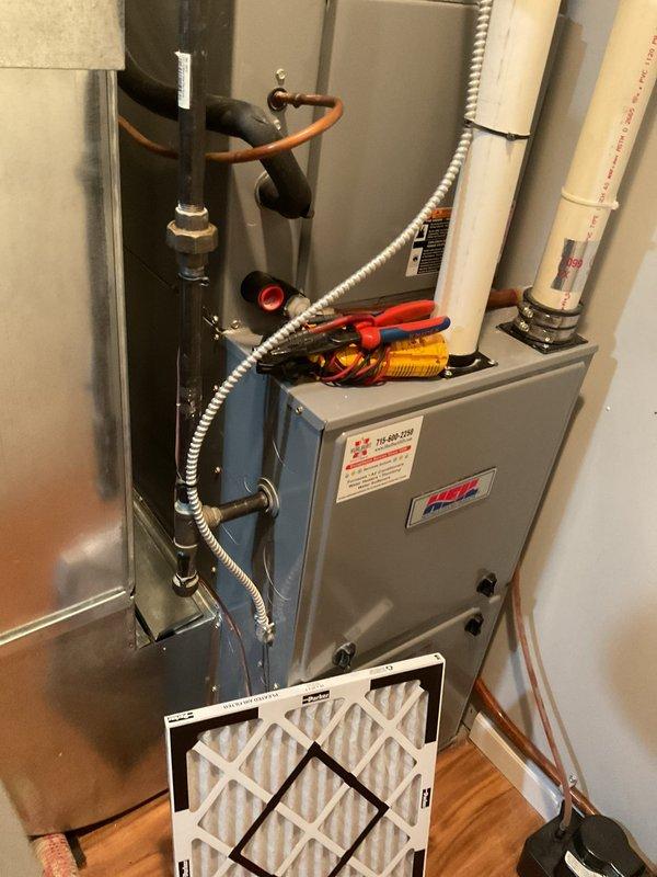 Completed routine Family Rewards cooling maintenance visit on 2013 air conditioning system. Performed comprehensive AC tune-up including filter replacement, condenser coil washing, and full component inspection. System operating properly with 21° temperature drop across evaporator coil, indicating optimal performance. Recommended installation of water detection device near furnace condensate pump to prevent potential basement flooding in event of pump failure.
