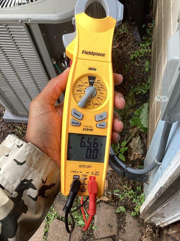 Responded to service call for 2-year-old Lennox central air conditioning unit experiencing breaker trips and intermittent operation. Upon inspection, found outdoor condenser unit heavily soiled with debris accumulation restricting airflow. Performed thorough cleaning of condenser coil and exterior unit components. Cleared false error code displayed on thermostat that resolved after cleaning. Tested system operation with digital multimeter, confirmed proper amperage draw and voltage readings. Enrolled customer in rewards membership program and advised annual maintenance cleaning schedule to prevent future issues. System restored to normal operation.