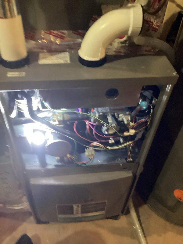 Completed annual air conditioning tune-up on 2-year-old system. Performed comprehensive maintenance inspection of furnace and thermostat operation. System verified thermostat displaying 74°F with fan running properly, inspected furnace internal components including control board wiring and connections, and confirmed all equipment operating within normal parameters with no issues identified.