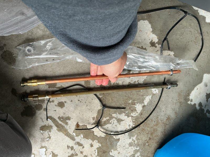 Installed new exterior faucet on front of garage by routing copper jumper line from existing garage spigot through brick wall, as direct house penetration was not feasible due to brick construction. Replaced leaking stem on existing garage faucet. All connections tested and verified leak-free with proper operation confirmed.
