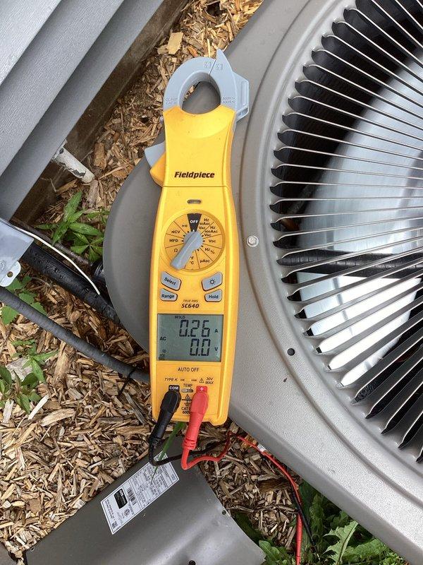 Completed scheduled air conditioning tune-up and maintenance on a 4-year-old system with no reported issues. Performed comprehensive inspection including cleaning of outdoor condensing unit, verification of clean air filter, and electrical diagnostics with amp draw measurements confirming all readings within normal operating parameters. System found to be in good working condition with all components functioning properly.