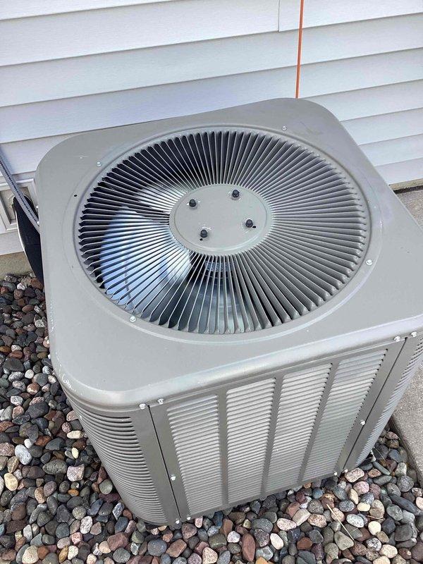 Responded to service call for non-operational outdoor condensing unit. Upon arrival, performed diagnostic inspection and confirmed condenser fan motor failure with no blade rotation when unit attempted to start. Motor tested with multimeter showed open windings and no electrical continuity, indicating complete motor burnout. 

Verified failure was covered under existing parts warranty and proceeded with replacement. Disconnected electrical supply at disconnect box and confirmed zero voltage before beginning work. Removed fan grille assembly and extracted failed motor from mounting bracket. Disconnected motor wiring from capacitor and contactor terminals, documenting wire routing for proper reinstallation.

Installed new warranty replacement condenser fan motor, ensuring proper mounting alignment and secure fastening to bracket. Reconnected electrical connections to capacitor and contactor per manufacturer specifications, verifying all wire terminals were tight and properly seated. Rein