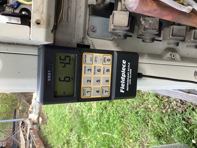 Responded to refrigerant leak on multi-zone mini-split system serving commercial space. Repaired refrigerant leak, performed system evacuation to remove moisture and contaminants, and recharged system with 6 pounds of R410A refrigerant. Added UV dye to system for future leak detection. Cycled system through complete operation, verified proper refrigerant charge using diagnostic equipment, and confirmed adequate cooling performance at all indoor air handler units.