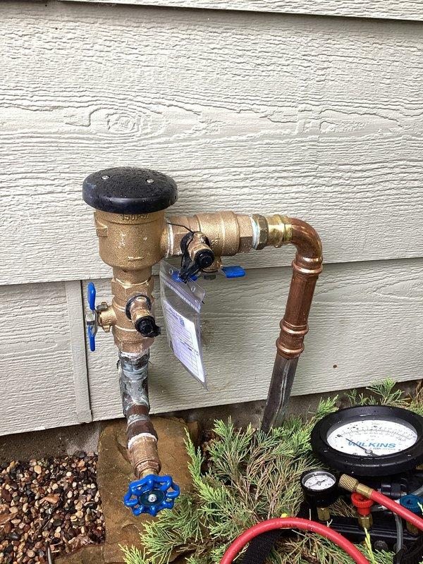 Performed annual backflow prevention device testing on exterior pressure vacuum breaker (PVB) assembly for permit compliance. Installed test cocks as required, connected diagnostic gauges, and conducted pressure differential testing per industry standards. All test results verified proper operation of the vacuum breaker, with the device passing inspection requirements.