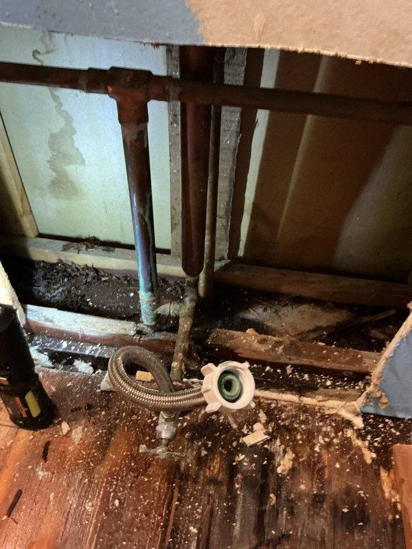 Responded to emergency plumbing call for multiple leaks that developed overnight. Located and repaired broken copper water line behind toilet within wall cavity, requiring access through wall opening. Replaced deteriorated bathroom faucet and complete kitchen sink assembly due to age and failure. Performed minor repairs to toilet fixtures including supply connections and internal components. Addressed underlying pipe issues beneath kitchen sink area where corrosion and aging copper lines showed significant oxidation and patina buildup. All work completed according to provided estimate, with multiple fixtures requiring replacement due to extensive deterioration throughout the plumbing system.