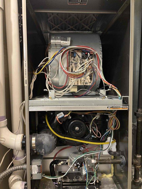 Performed comprehensive A/C maintenance on single condenser unit with R-410A refrigerant system. Conducted full system inspection including filter, thermostat, temperature drop measurement, condenser coils, motors, capacitors, compressor, refrigerant levels, and condensate drain. System was reported to be running extended cycles and struggling to maintain cooling during hot, humid conditions. Diagnostics revealed low refrigerant charge. Added UV leak detection dye and recharged system to proper operating levels. System tested and confirmed operating normally upon completion. Provided recommendations for future repairs and documented equipment specifications.