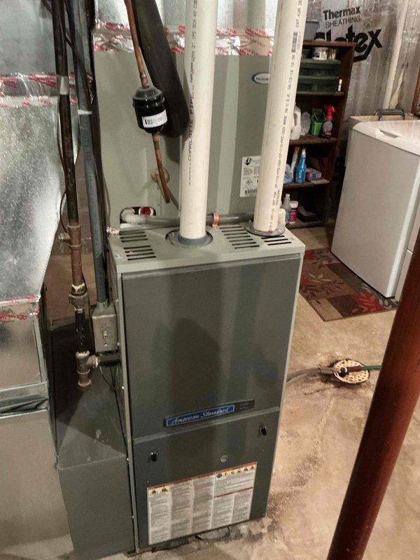 Completed comprehensive air conditioning tune-up and inspection on 8-year-old American Standard system. Unit was fully operational with no known issues at time of service. Installed locking refrigerant caps for security, added hard start kit to compressor for improved efficiency and longevity, and upgraded to new Ritetemp digital thermostat for enhanced temperature control.