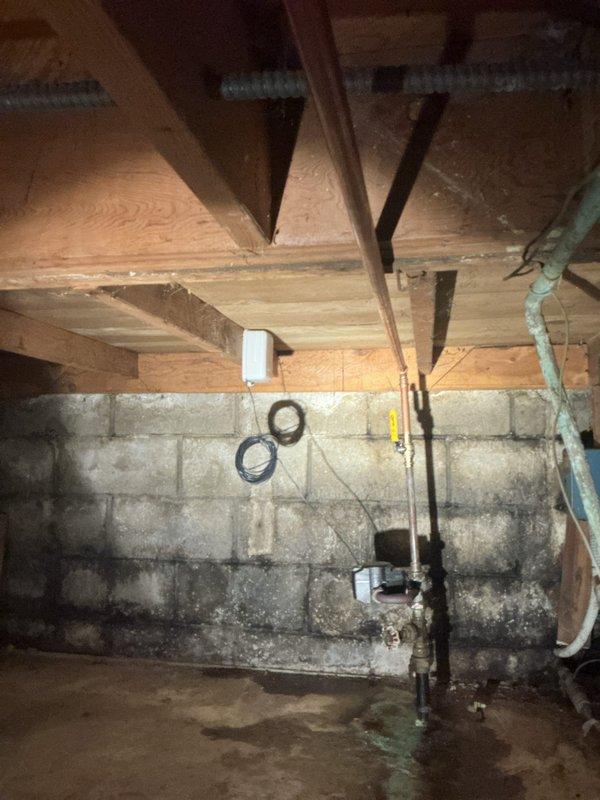 Responded to emergency water leak in basement utility area where main 3/4" copper supply line exhibited multiple active leak points above the water meter. Removed compromised 8-foot section of deteriorated copper piping that had been temporarily patched. Installed new 3/4" copper pipe with 7 fittings and integrated a new 3/4" ball valve for improved system control and future maintenance access. Repaired two additional visible leaks at pipe joints. All connections pressure tested and verified leak-free upon completion.