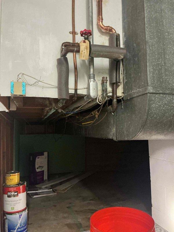 Responded to emergency water leak in basement utility area where main 3/4" copper supply line exhibited multiple active leak points above the water meter. Removed compromised 8-foot section of deteriorated copper piping that had been temporarily patched. Installed new 3/4" copper pipe with 7 fittings and integrated a new 3/4" ball valve for improved system control and future maintenance access. Repaired two additional visible leaks at pipe joints. All connections pressure tested and verified leak-free upon completion.