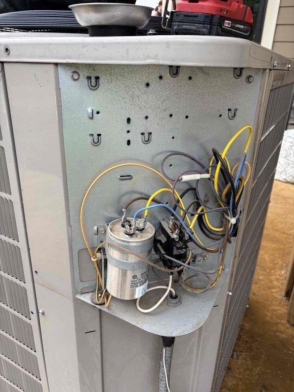 Completed comprehensive A/C maintenance on one R-410A condenser system with ambient temperature at 61 degrees. Performed full system inspection including filter, thermostat operation, temperature split measurement, condenser unit, evaporator and condenser coils, motors, capacitors, compressor functionality, refrigerant charge levels, and condensate drain line. Identified dual-run capacitor (45+5 μF) reading out of manufacturer specifications and recommended replacement for optimal system performance; customer declined repair at this time. Also recommended air filter replacement. System currently operating within normal parameters with no refrigerant leaks detected and all other components functioning as designed.