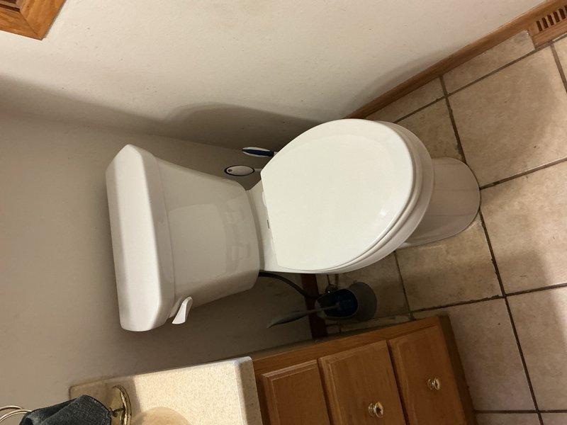 Responded to request for toilet replacement in upstairs bathroom. Removed existing standard-height toilet and installed new ADA-compliant height toilet matching unit previously installed in another bathroom. Verified proper seating, seal integrity, and flush operation upon completion.