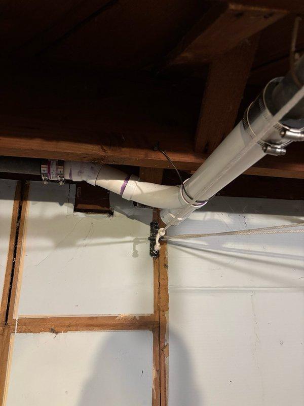 Replaced deteriorated kitchen drain pipe in basement showing multiple holes and cracks in horizontal steel section. Cut out and removed approximately 12-15 feet of damaged steel pipe and installed new 1 1/2" PVC pipe with necessary fittings. Reattached sink trap and conducted thorough leak test by running water for 10 minutes and performing five full sink drain cycles with no leaks detected. Work area cleaned upon completion.