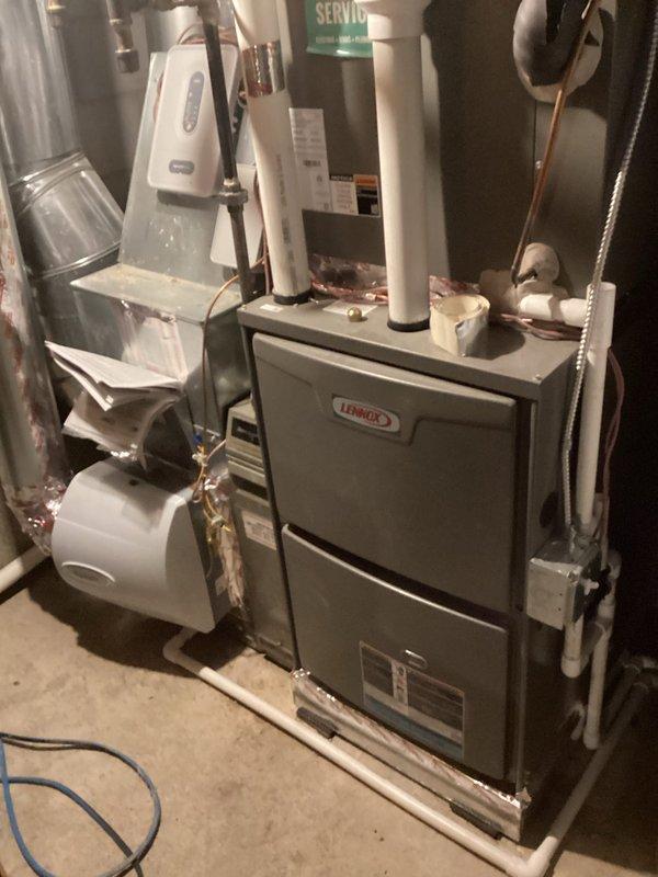Completed comprehensive AC tune-up on Lennox system with indoor furnace and outdoor condensing unit. Addressed thermostat filter change reminder issue by adjusting settings to disable recurring prompt after customer had already replaced filter. Performed full system inspection including checking refrigerant levels, electrical connections, and airflow; confirmed all components operating within manufacturer specifications and system running as designed.