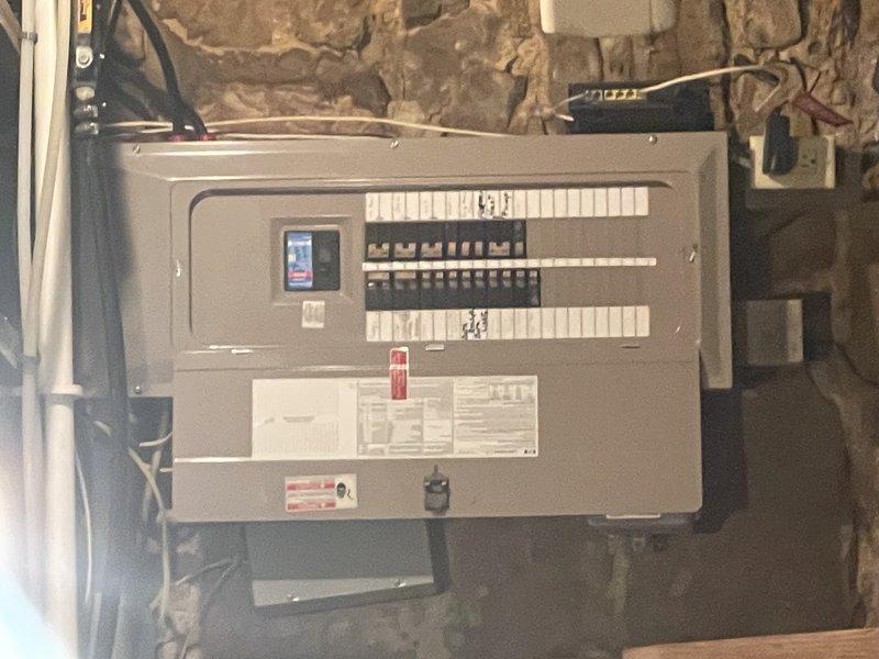 Responded to service call for furnace that would not shut off. Thermostat wire had been severed during recent basement construction work when support beam was installed, causing system control failure. Located damaged wire section, repaired broken thermostat wire connections, and properly re-stapled wiring along pathway to prevent future damage. Tested and verified proper operation of both heating and cooling cycles on heat pump system. Unit now cycling correctly with thermostat commands.