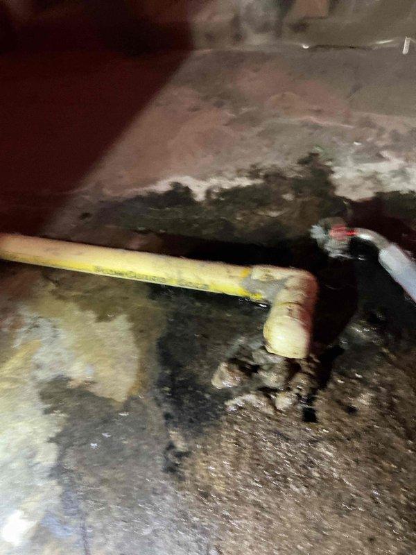 Responded to no heat call on 10+ year old furnace following recent AC installation. Upon inspection, discovered condensate drain line plugged at floor drain, causing water backup into draft inducer motor and pressure switches, resulting in pressure switch failure and system lockout. Cleared drain blockage, removed water from draft inducer motor and pressure switch assembly, and restored system to proper operation.