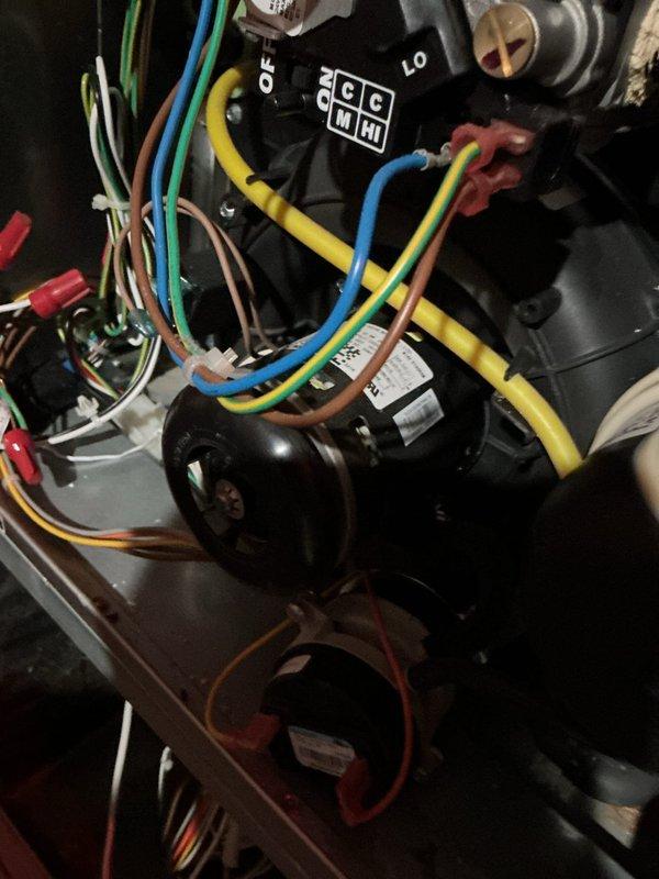 Responded to no heat call on 10+ year old furnace following recent AC installation. Upon inspection, discovered condensate drain line plugged at floor drain, causing water backup into draft inducer motor and pressure switches, resulting in pressure switch failure and system lockout. Cleared drain blockage, removed water from draft inducer motor and pressure switch assembly, and restored system to proper operation.