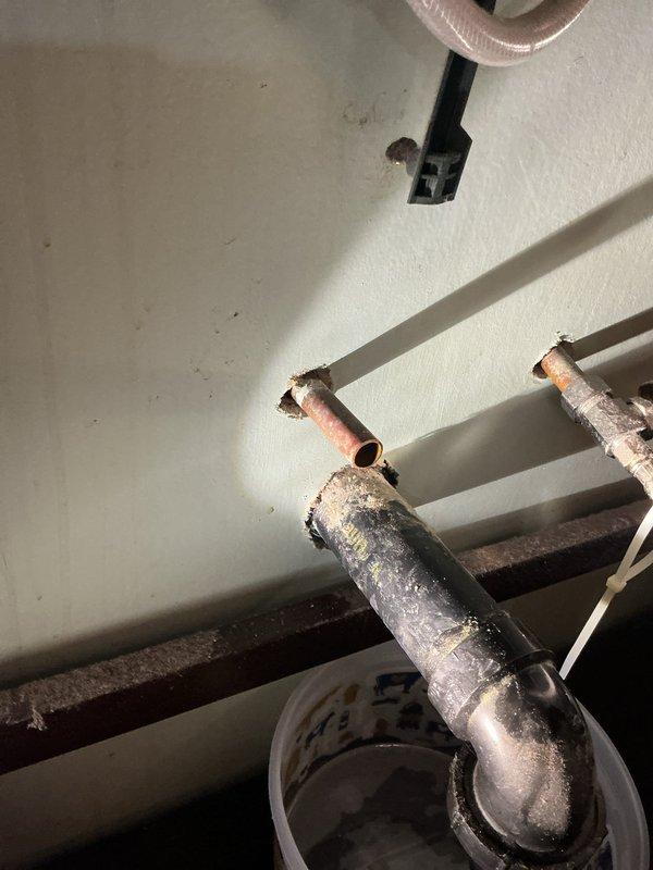 Responded to upstairs bathroom leak originating from under the vanity sink. Upon inspection, identified a faulty hot water angle stop as the source of the leak, which continued even when the hot water supply was shut off. Removed the corroded, deteriorated angle stop and installed a new replacement valve to restore proper function and eliminate the water leak.