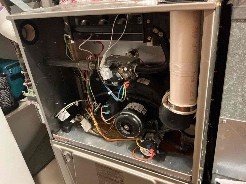 Performed comprehensive preventative maintenance inspection on 16-year-old Carrier air conditioning system. Verified contactor and capacitor operation within normal parameters. Inspected outdoor coil condition, noting minor dirt accumulation; cleaning deferred due to lack of water source availability. Cleaned electrical compartment of debris and dust. Verified refrigerant charge at proper levels with no leaks detected. Measured compressor and condenser fan motor amp draws, confirming all readings within manufacturer specifications. Inspected furnace filter, finding it in acceptable condition. Verified control board functionality with no error codes present. Inspected indoor evaporator coil and blower wheel assembly, both found clean with no buildup. Measured supply and return air temperatures, confirming 18-degree temperature split within optimal range. System operating efficiently with no deficiencies identified and no repairs or recommendations necessary at this time.