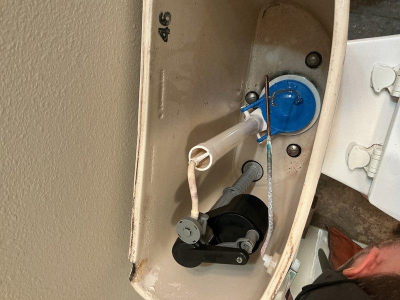 Responded to warranty callback for downstairs toilet continuing to make running noises after previous service visit. Upon inspection, determined the fill valve was operating sporadically, causing the persistent noise issue. Removed the defective fill valve and installed a new replacement unit. Tested toilet operation to verify proper fill cycle and confirm elimination of running water sounds. System now functioning correctly with no further issues detected.