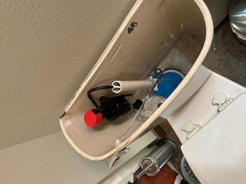 Responded to warranty callback for downstairs toilet continuing to make running noises after previous service visit. Upon inspection, determined the fill valve was operating sporadically, causing the persistent noise issue. Removed the defective fill valve and installed a new replacement unit. Tested toilet operation to verify proper fill cycle and confirm elimination of running water sounds. System now functioning correctly with no further issues detected.
