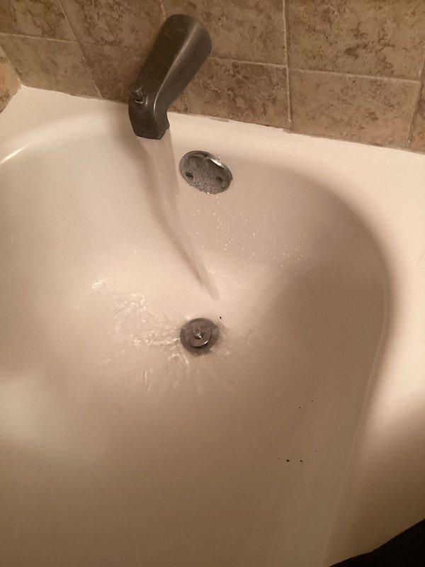Responded to a clogged bathtub drain caused by accumulated hair buildup. Manually removed the drain stopper assembly and extracted the hair blockage from the drain line, restoring proper drainage. Verified water flow and confirmed the fixture was functioning correctly upon completion.