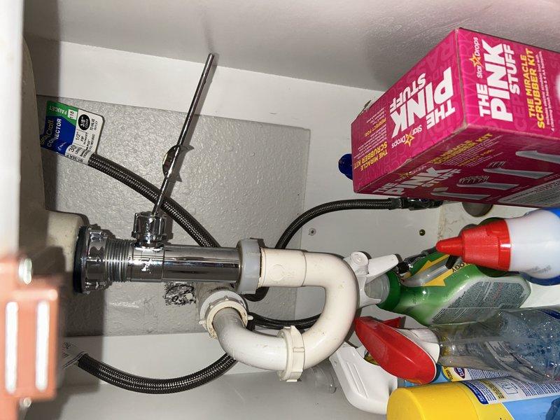 Responded to multiple plumbing issues throughout the property. Addressed bathroom sink drain obstruction with stuck stopper mechanism and faulty release valve assembly beneath sink. Investigated lack of hot water supply to bathroom shower fixture. Assessed malfunctioning garbage disposal unit. Inspected and evaluated cracked P-trap assembly at outdoor grill area ice drain location. Documented all conditions with photographic evidence for service records.