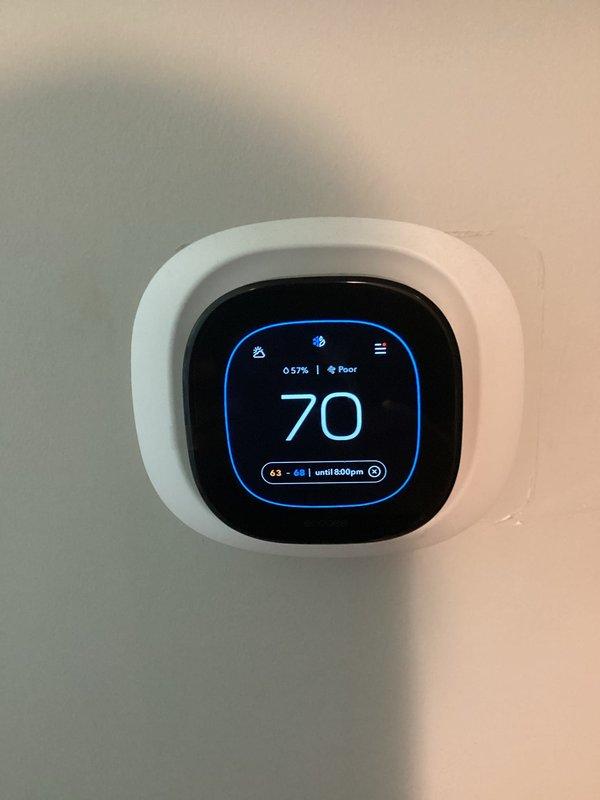 Completed comprehensive air conditioning tune-up and inspection on newer system. Verified all components are clean and operating within normal parameters. Smart thermostat displaying proper temperature readings and system cycling correctly. Inspected air filter showing good condition with proper airflow direction. Customer reported failed bathroom exhaust fan during visit; provided estimate for replacement unit.