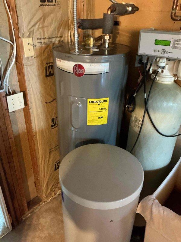 Responded to service call regarding reverse osmosis system producing loud gurgling noises for 10-30 minutes after shutoff and experiencing continuous drainage issues. Upon inspection of the utility room mechanical space, assessed the RO system installation adjacent to Rheem water heater and related plumbing infrastructure. Documented equipment configuration and system components with photographic evidence showing RO unit, water softener tank, and associated piping connections. Identified potential filter-related concerns contributing to abnormal operational sounds and drainage problems. Coordinated comfort advisor follow-up appointment for comprehensive system evaluation and recommended service solutions.