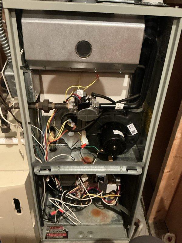 Completed annual AC tune-up on 5-year-old system under warranty; all components tested within specifications, refrigerant levels and temperature split verified as satisfactory, unit fully operational. Provided 16x25x1 furnace filter as requested. During inspection, discovered critical safety issue on 22-year-old furnace: cracked heat exchanger above high limit switch presenting carbon monoxide leak hazard. Documented findings with photos and scheduled furnace replacement estimate.